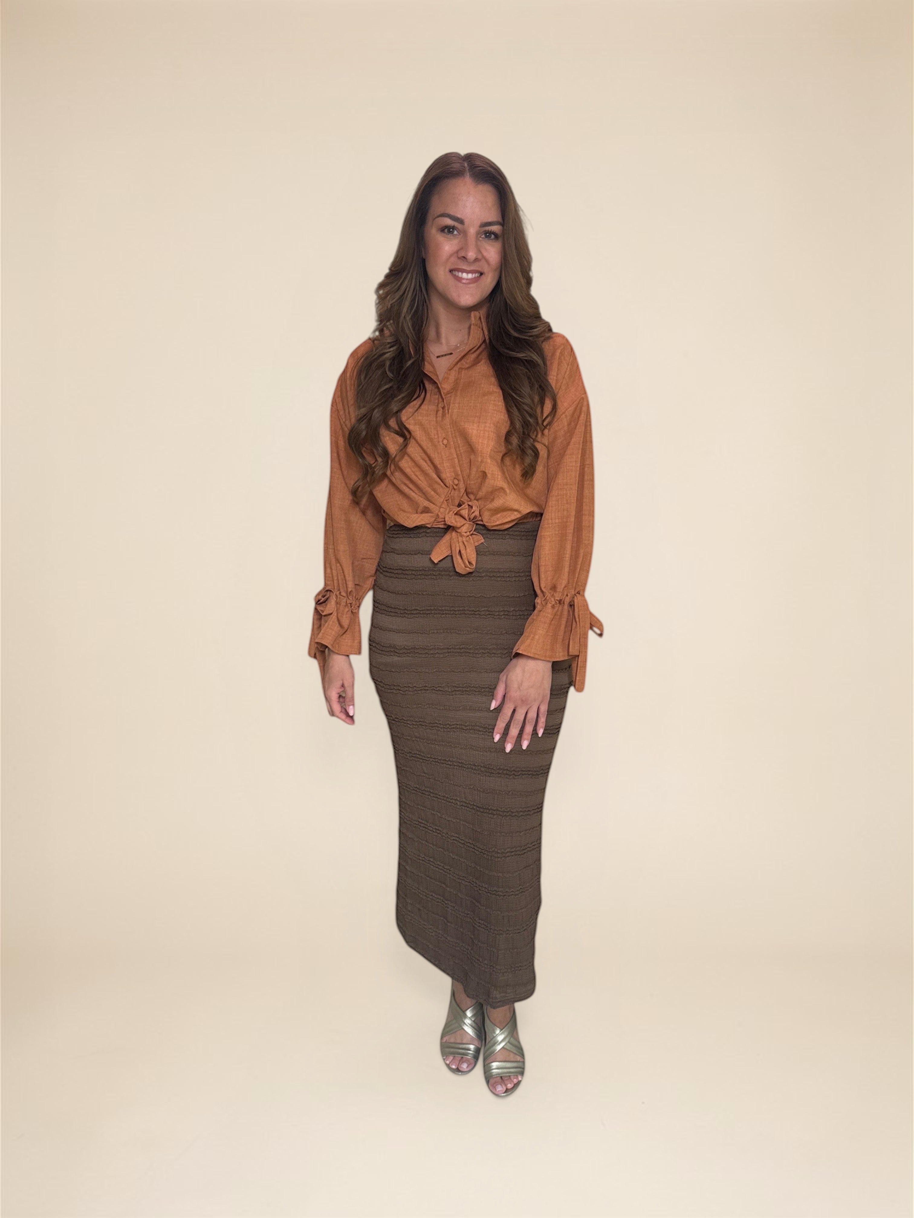 Just Favorites brown structured midi skirt with elastic waistband and stretch fabric.